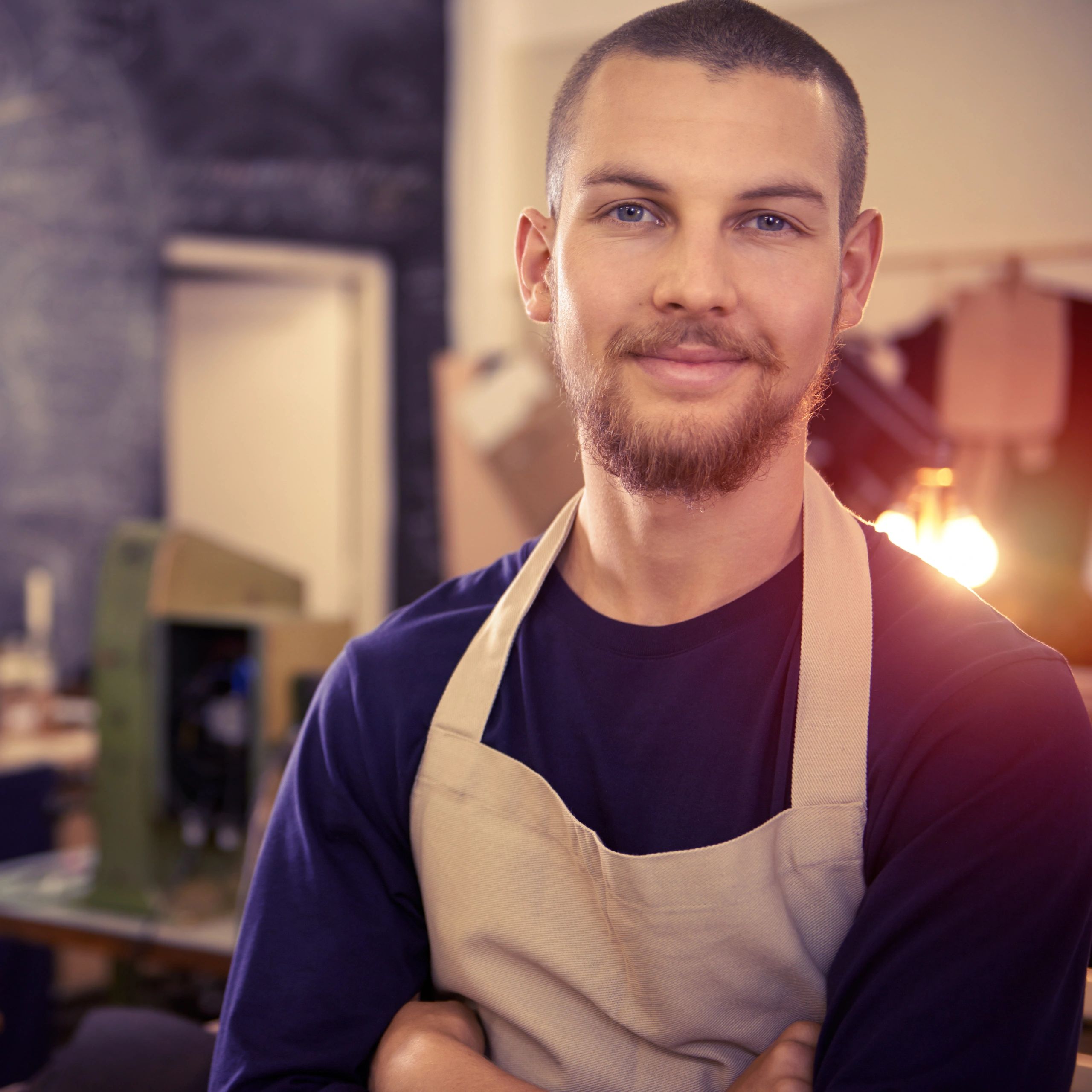Portrait of a smiling artisan in a workshop